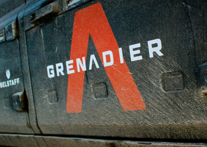 An example of our automotive branding services in action – a close-up of Grenadier vehicle branding, featuring bold typography and rugged styling