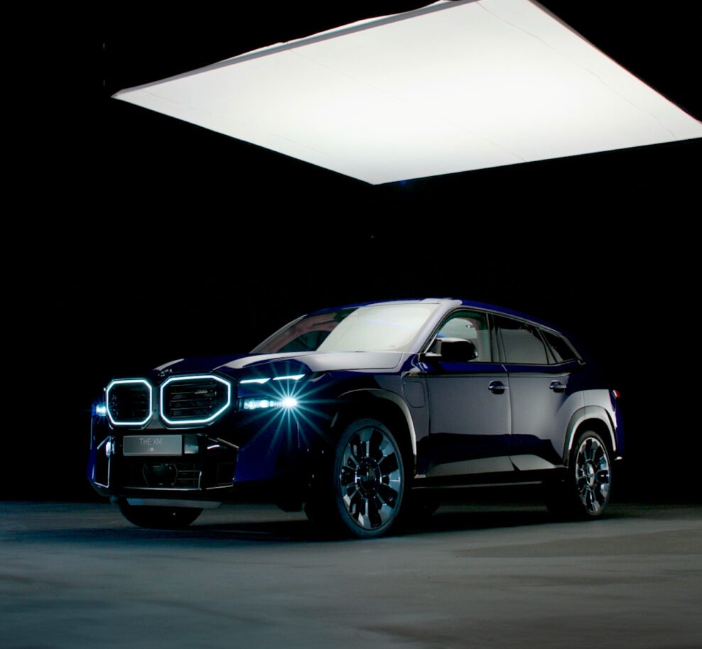 A Juice-produced automotive marketing still showcasing the bold design of the BMW XM, BMW’s first electrified high-performance M model, combining luxury and innovation.