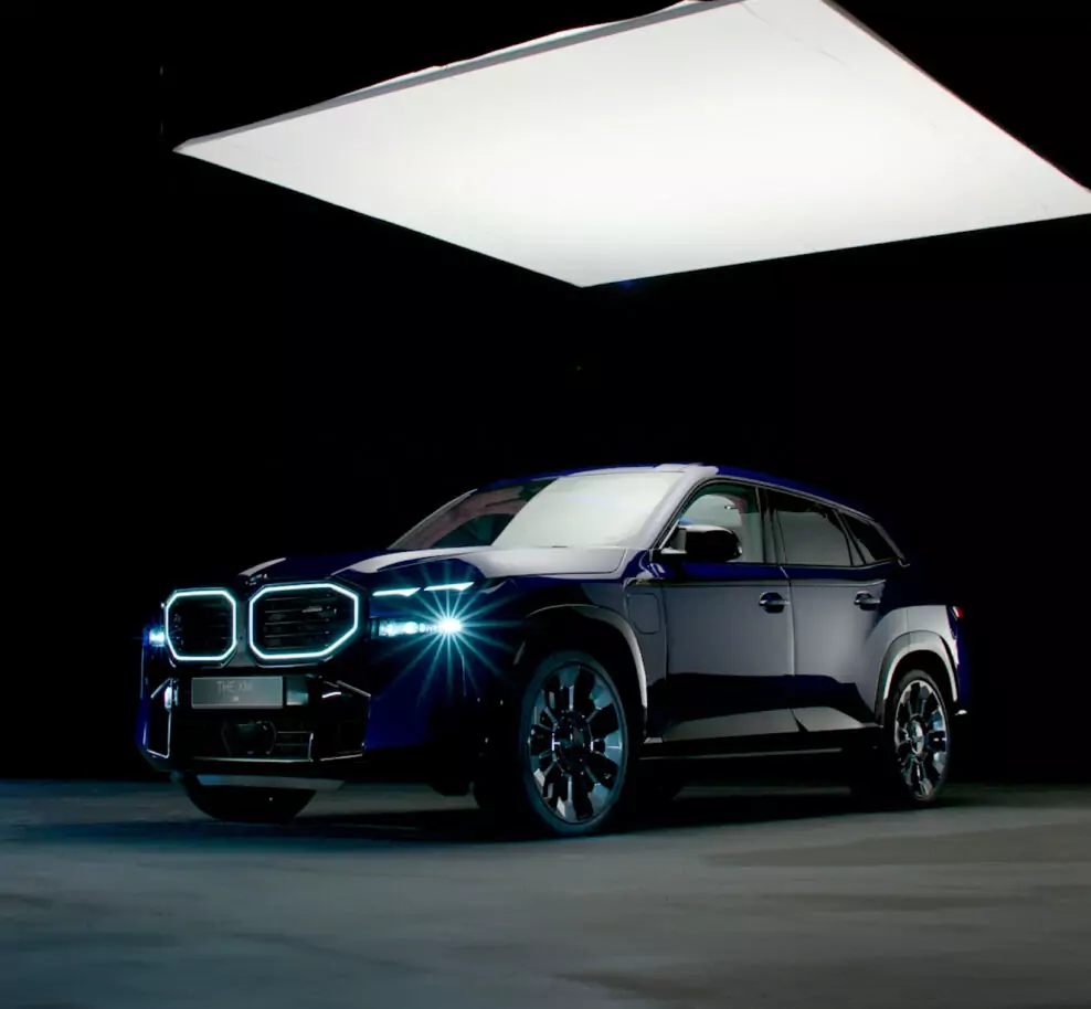 A Juice-produced automotive marketing still showcasing the bold design of the BMW XM, BMW’s first electrified high-performance M model, combining luxury and innovation.